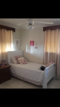 Cama cuna en caoba