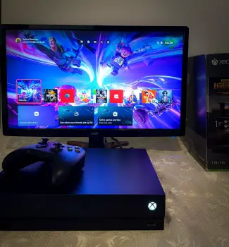 Xbox one x 1tb como nuevo más monitor gaming
