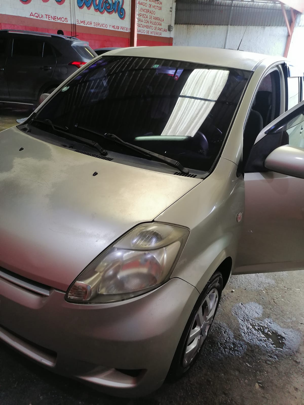 Vendo Toyota Passo color dorado año 2009  Foto 7268396-8.jpg